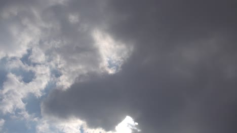 beautiful time lapse of cloudscape with bright sun shining with clouds passing