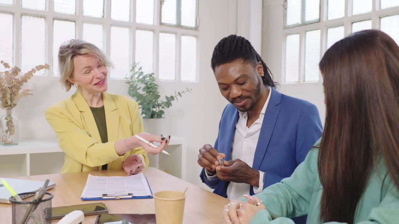 Business meeting with diverse team negotiating a contract