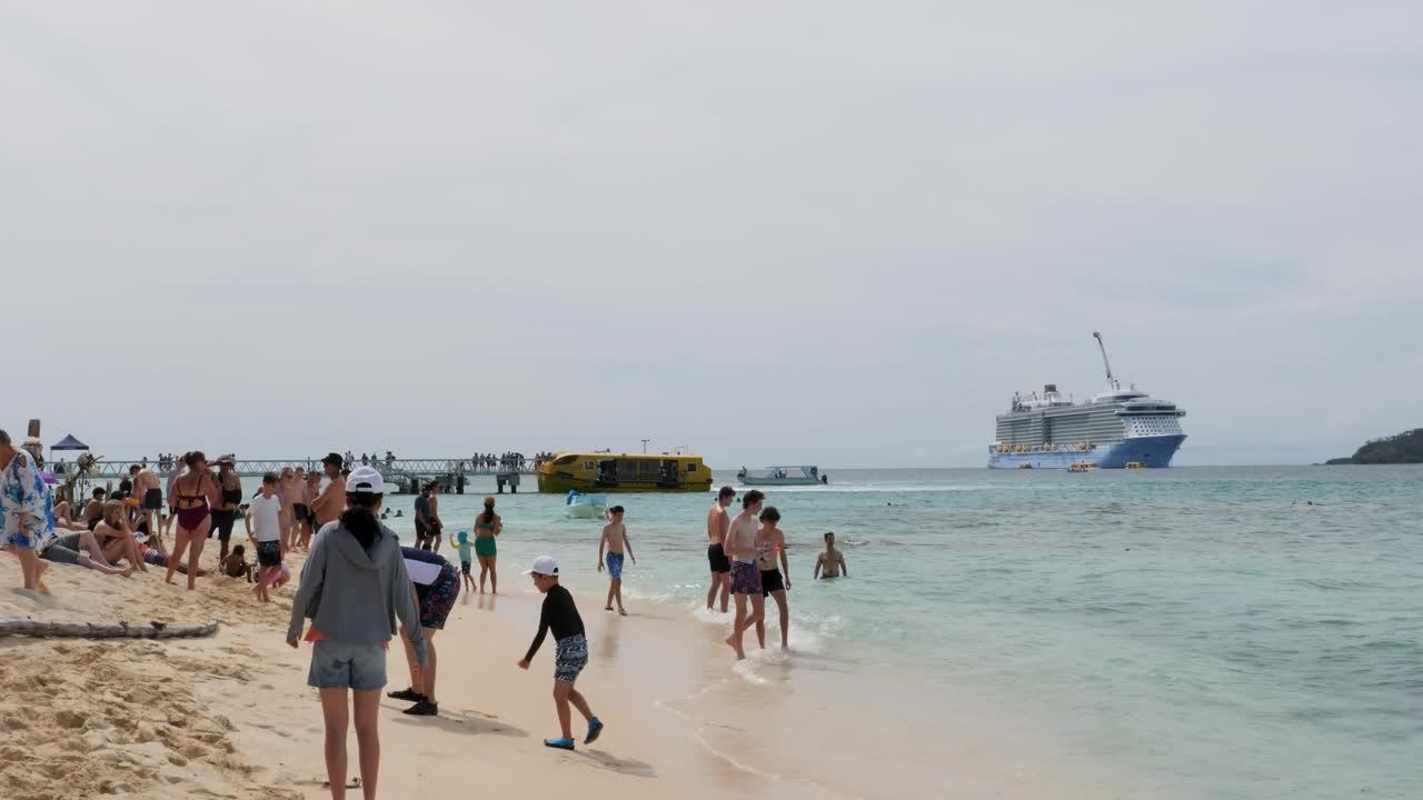 Cruise ship passengers enjoying a tropical beach
