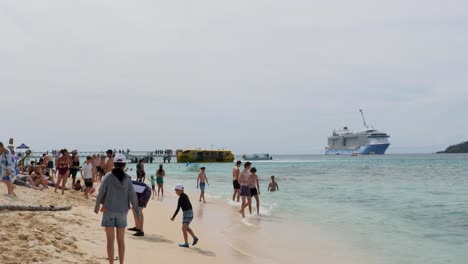 cruise ship passengers enjoying a tropical beach