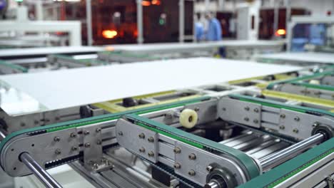 process of making clean solar panels inside a modern factory. automated machine for producing solar cells. robotic equipment of contemporary plant.
