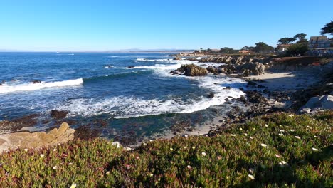 calm ocean waves crashing over monterey beach california - winter - 4k