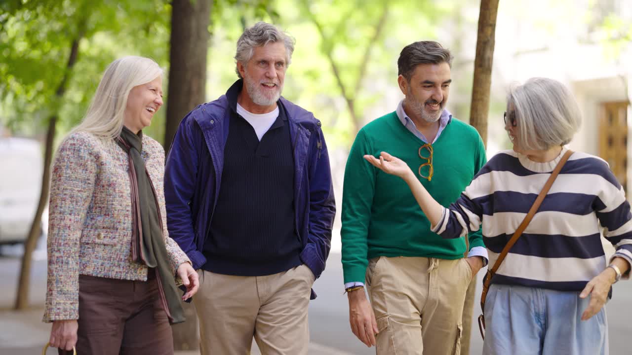 Group of mature adults walking on a city street