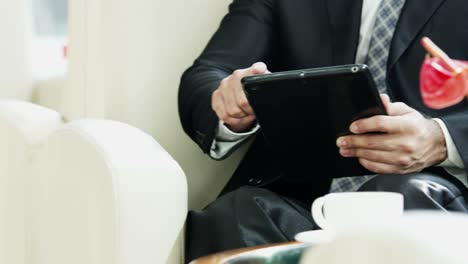 arabic corporate male financial executive with wireless device