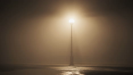 solitary street lamp in heavy fog