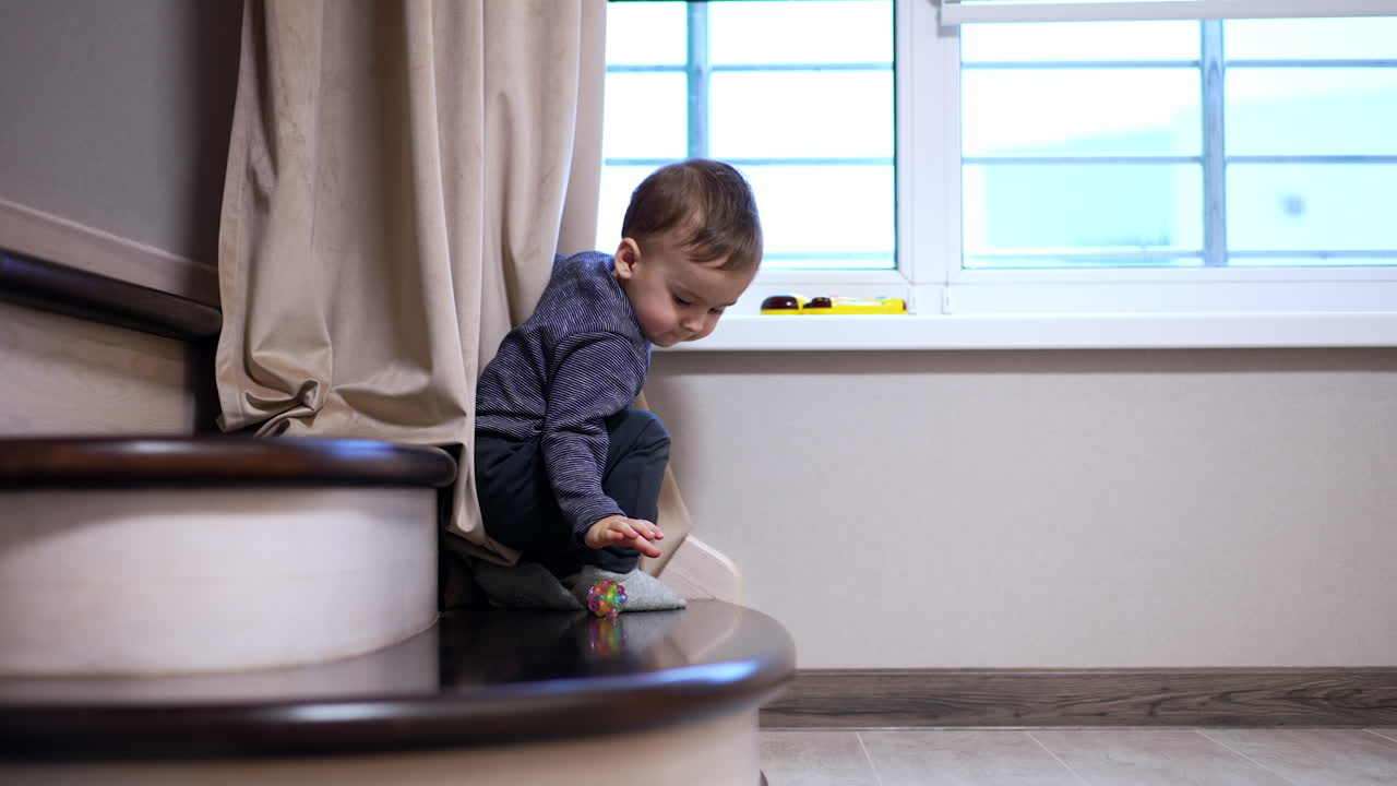 Baby Playing on Stairs