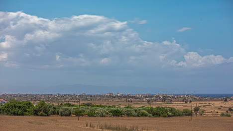 Fast-moving-clouds-above-landscape,-static