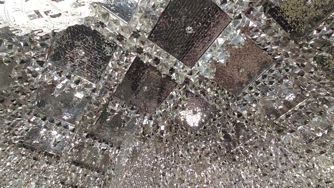 Intricate Crystal Ceiling Decoration in Ornate Interior