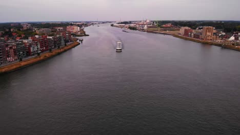 Overhead-view-of-cargo-ship-navigating-the-river's-waters