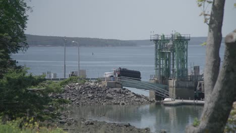 wide-daytime-exterior-of-gas-truck-backing-into-ferry