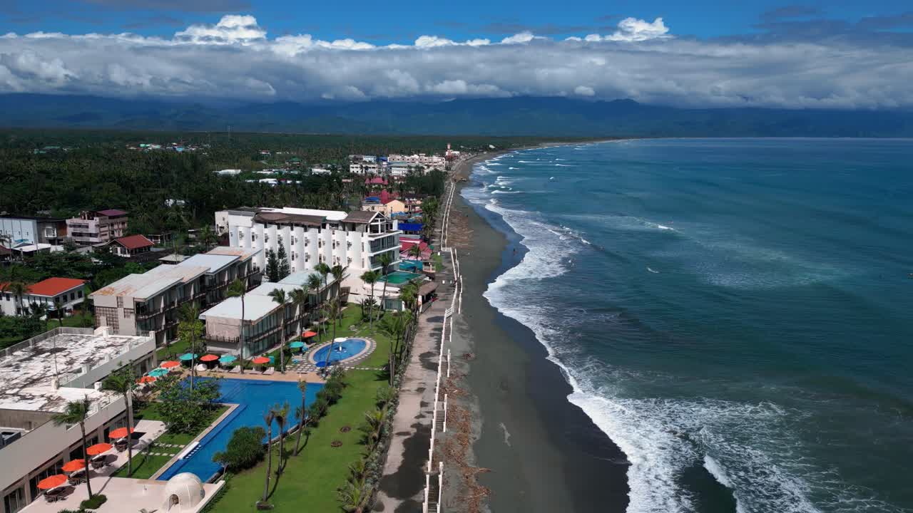 A stunning wide-angle drone shot showcases the shoreline blending seamlessly with the endless ocean, creating a serene and picturesque coastal view.