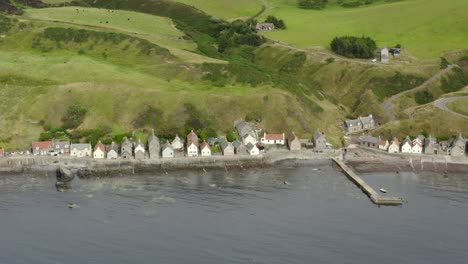 aerial view of the crovie village on the aberdeenshire coastline on an overcast summer evening