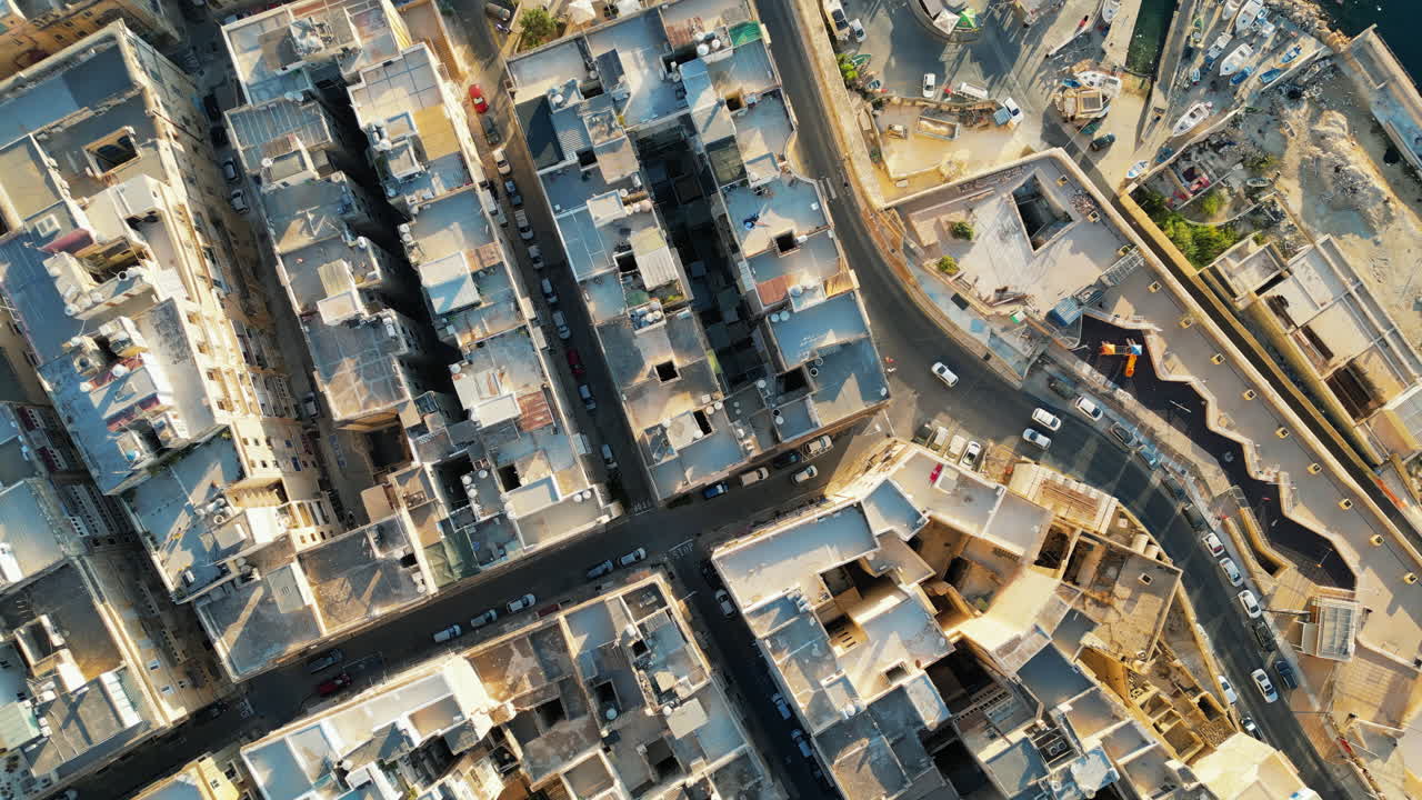 Aerial drone view of the walled city of Valletta, Malta, surrounded by the Mediterranean sea in daylight