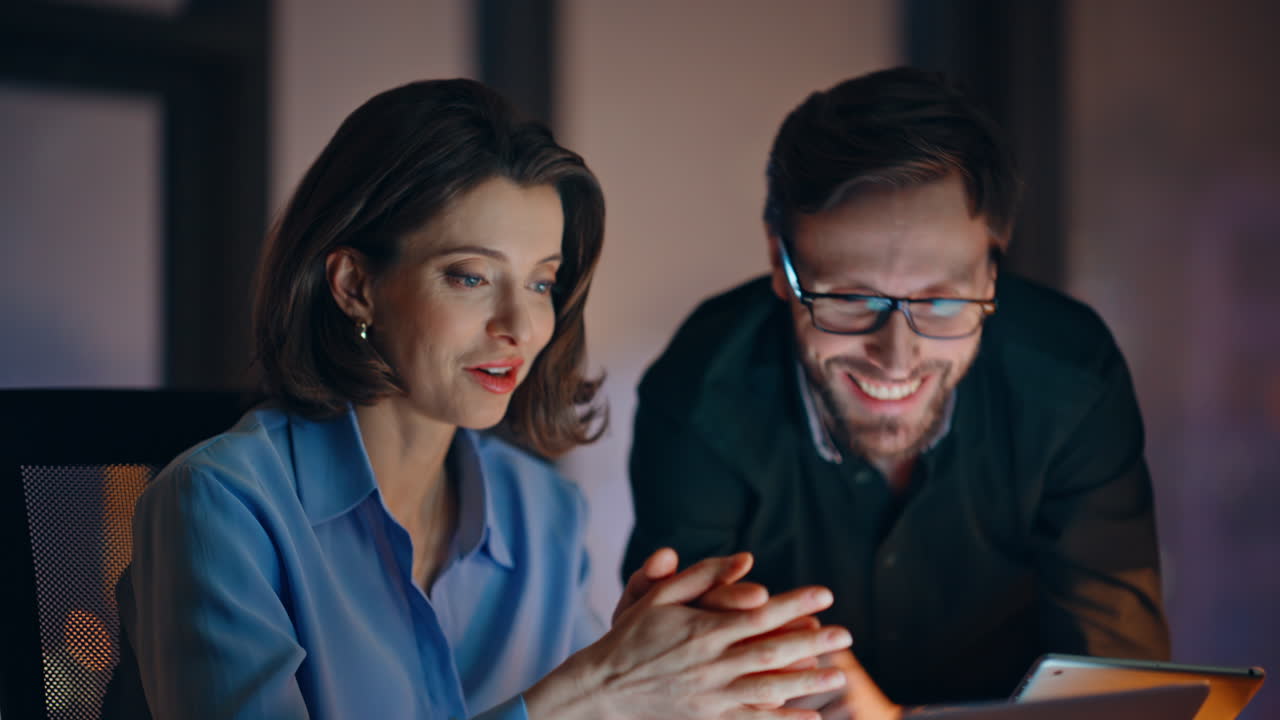 Team members creating business project late evening at company workplace closeup