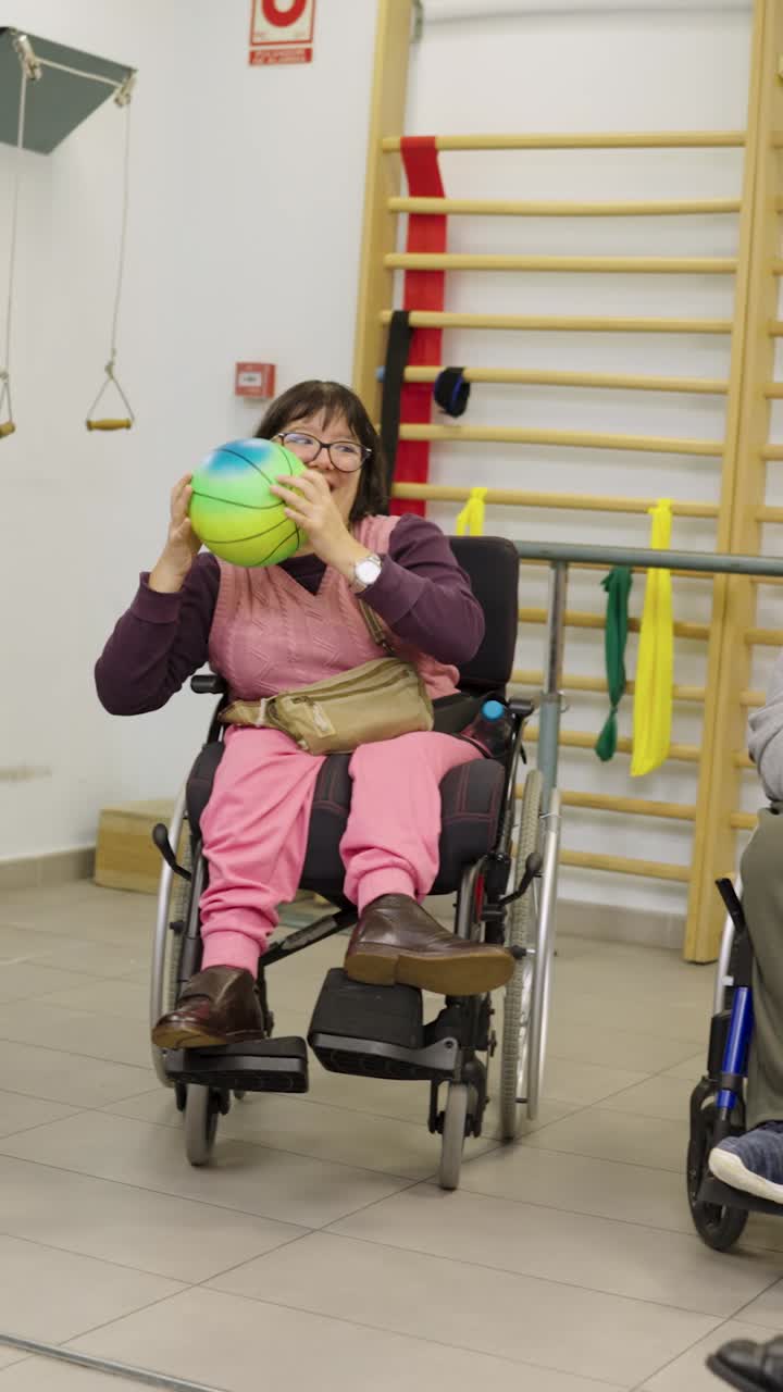Group of People with Disabilities Playing with a Ball in Wheelchairs