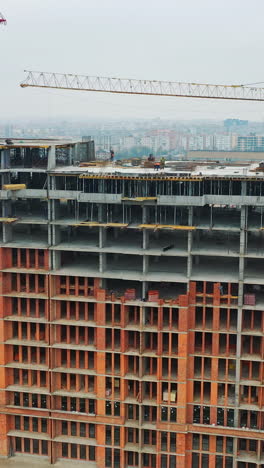 construction of a residential apartment complex. aerial view. vertical video