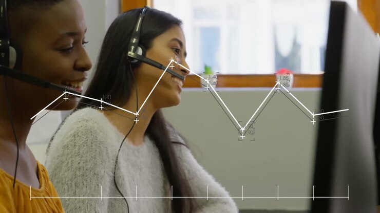 Animation of diagram over diverse female colleagues using phone headsets
