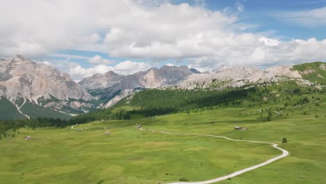 aerial cinematic footage of the lush green meadows of pralongia in the italian dolomites