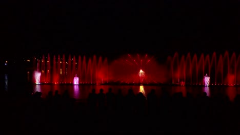 fountain with colorful illuminations at night. aerial shot of the magic fountain - lights,colors and music spectacle at night