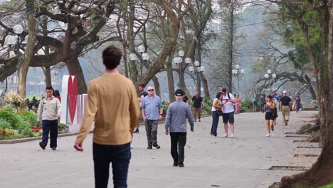 people enjoying a leisurely walk in the park