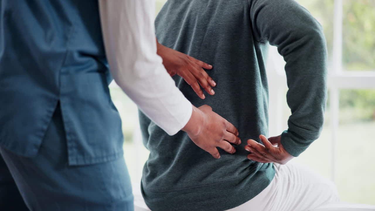 Nurse, physiotherapy and hands massage back pain