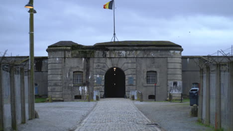 the paved road leading to the entrance of the fort of breendonk. a nazi prison camp in belgium during world war 2.