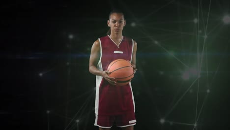 Animation-of-network-of-connections-over-female-basketball-player-on-black-background