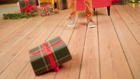Boy-is-dissappointed-about-his-Christmas-gift-and-throws-it-on-the-ground-and-kicks-it