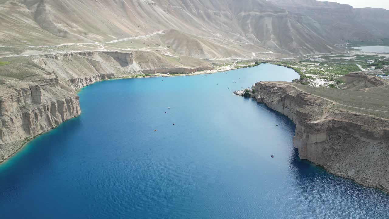 Aerial drone View of Band E Amir Lake and National Park in Afghanistan, Barren Hills and Blue Water
