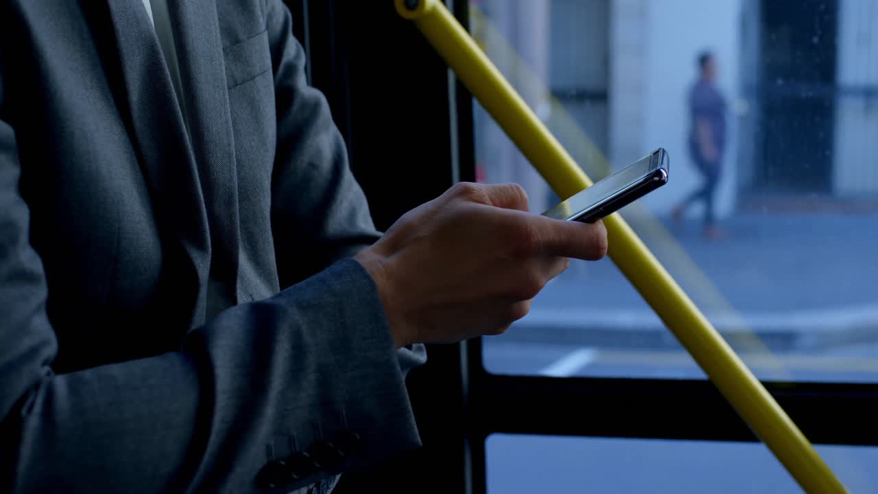 Business commuter using mobile phone while travelling in bus 4k