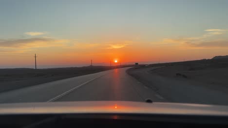 Sunset-wonderful-landscape-driving-in-the-road-trip-to-desert-scenic-travel-shot-wide-view-of-panoramic-roadtrip-perspective-in-peaceful-background-evening-time-summer-vacation-in-Iran-Utah-roads