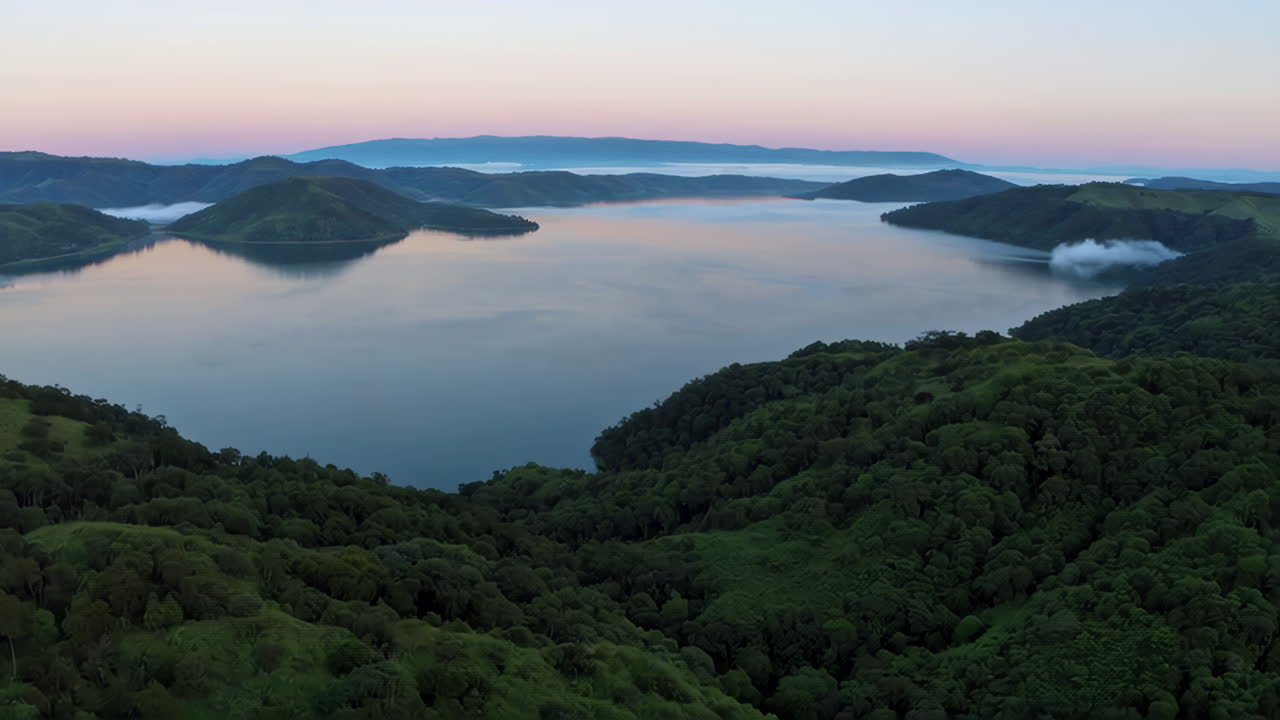 Aerial View of a Mountain Lake at Sunrise/Sunset