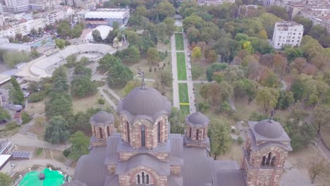 Beautiful-establishing-4k-aerial-shot-of-St-Mark-Church-in-Tasmajdan-park-Belgrade
