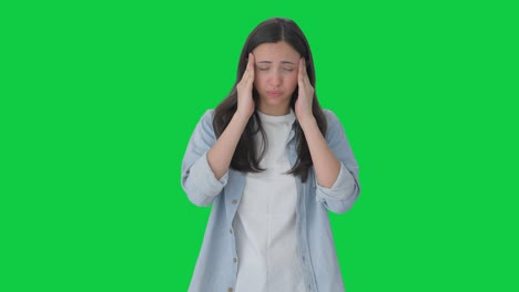 indian girl having a headache green screen