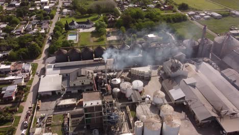 drone flying over industrial chimney of food factory in buenos aires province, argentine