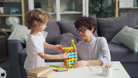 mother and child playing with building blocks
