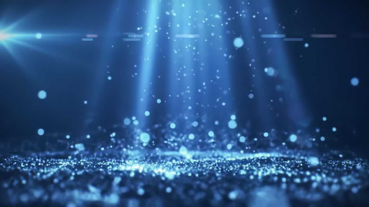 In a dark environment, vibrant blue light beams cascade down to reveal sparkling particles dancing in the air, creating a magical atmosphere that captivates and mesmerizes.