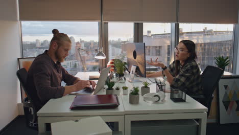 overworked programmers talking at office closeup. teammates preparing deadline