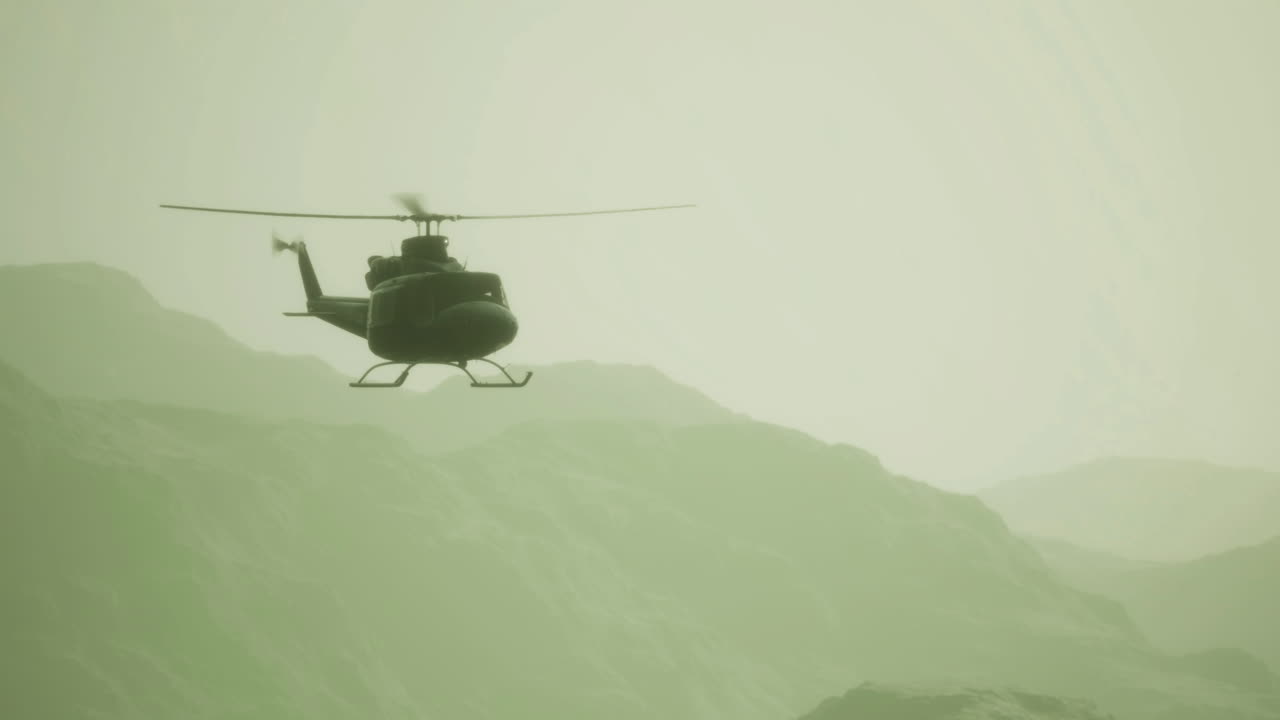 Helicopter soaring over misty mountains at dawn during a tranquil morning