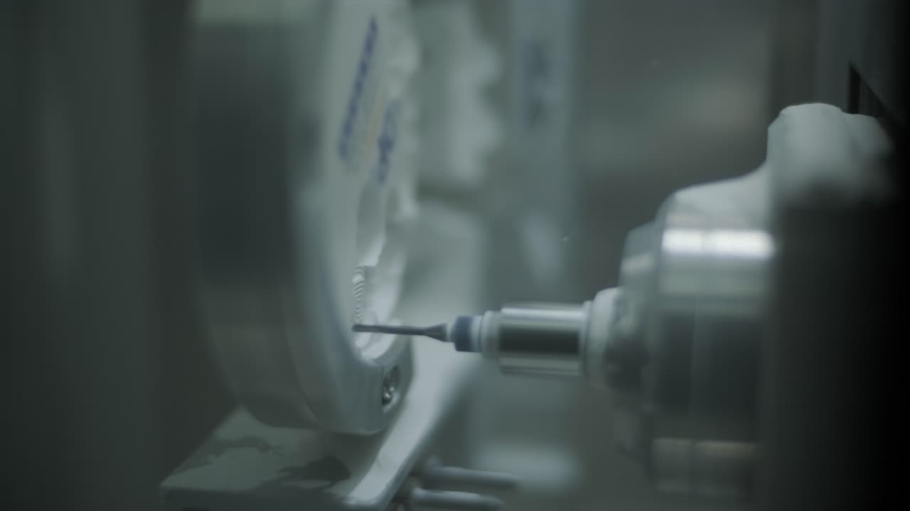 CNC Machine Cutting Zirconia Crowns from Unfired Zirconia