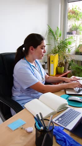 female doctor working in her office at clinic.