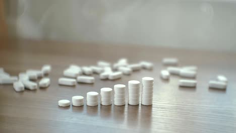 columns of tablets on the table close-up. the concept of increasing the price of medicines