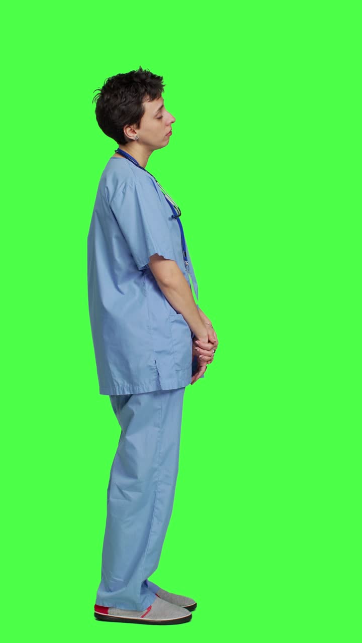 Profile Medical assistant feeling extremely sleepy against greenscreen backdrop