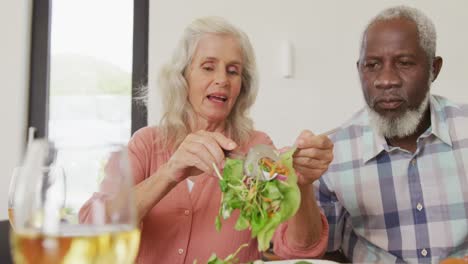 Happy-senior-diverse-people-having-dinner-at-retirement-home