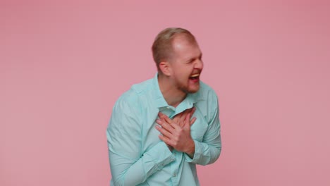 man pointing finger to camera laughing out loud making fun of ridiculous appearance funny joke