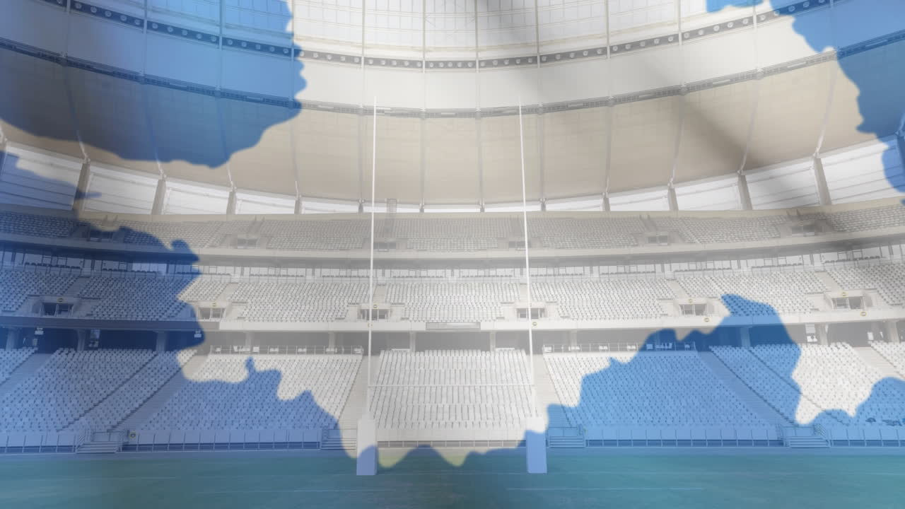 bandera ondeando frente a un estadio