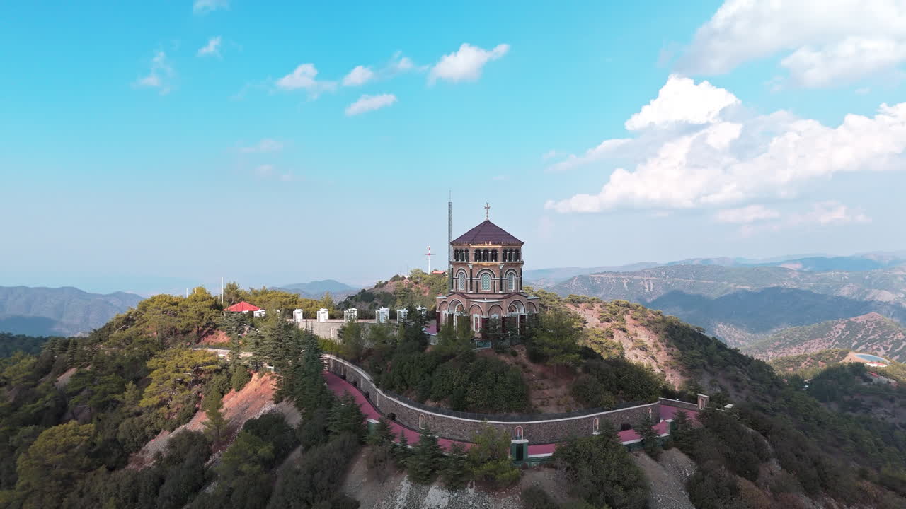 Archbishop makarios iii tomb in cyprus surrounded by scenic mountain landscape , aerial view