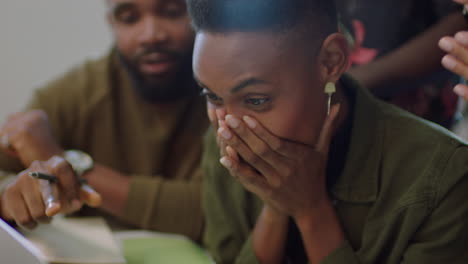 happy business people celebrating corporate success black colleagues enjoying successful victory clapping watching laptop in cheerful office workplace close up