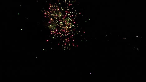 Slow motion fireworks exploding at night in vibrant colors