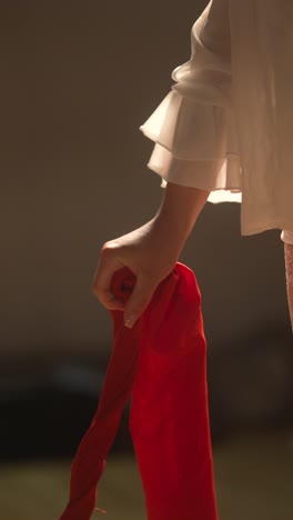 Woman Holding Red Fabric